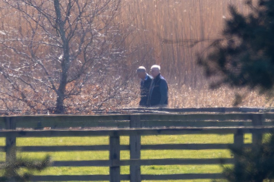 Andrew Mountbatten Windsor walking his dogs with his bodyguard in the countryside near Wood Farm in Wolferton, Norfolk.