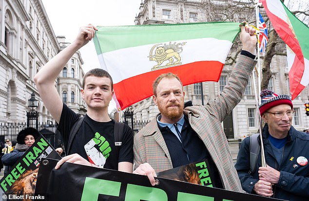 Mr Mitchell (left) is pictured here at an Iranian protest outside 10 Downing Street in February 2026