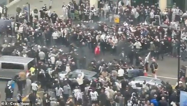 In the background sirens could be heard sounding as tensions rose on Sunday morning