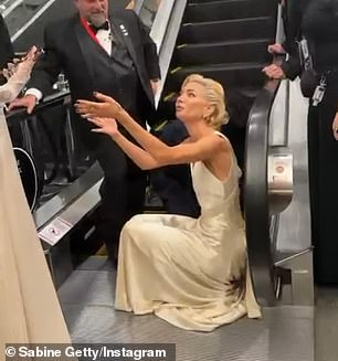 The hem of her gown appeared to have gotten caught at the very bottom, making it impossible for her to move