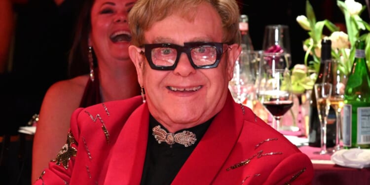 Elton John in mad dash to his own Oscars party in LA after he plays secret birthday gig in London 24 hours before