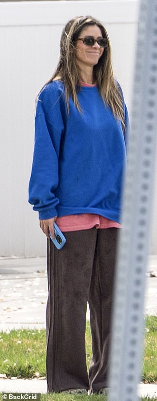 Despite the drama Paul is now embroiled in, she managed to crack a smile