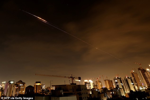 Israel and Iran have continued to trade blows as the war spirals and shows no sign of concluding. (Pictured: Rocket trails in the sky over the Israeli city of Netanya amid Iranian missiles)