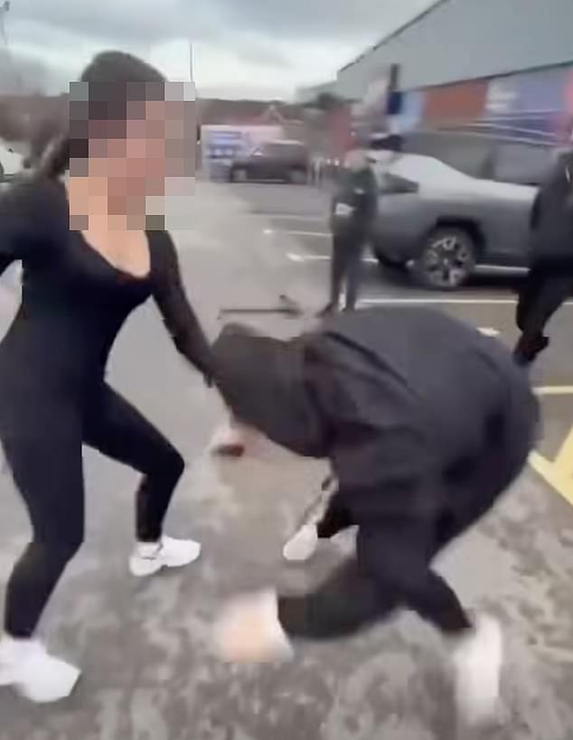 In a harrowing video, a group was seen attacking a young girl outside a nearby B&M store (pictured)