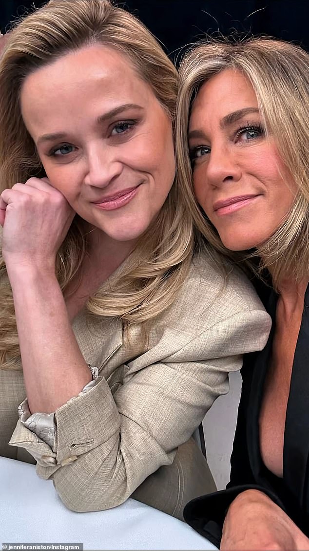Aniston posted selfies of the pair in business casual attire while on the set of their hit Apple TV+ series The Morning Show