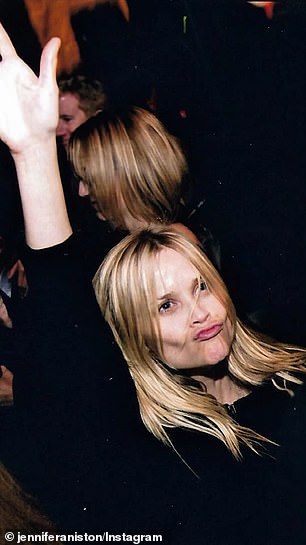 Witherspoon was seen puckering her lips and having fun on a crowded dance floor at an event