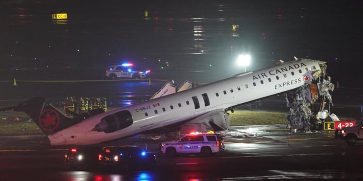 Plane crashes into fire truck on runway after landing leaving at least 4 injured as airport closes & flights suspended