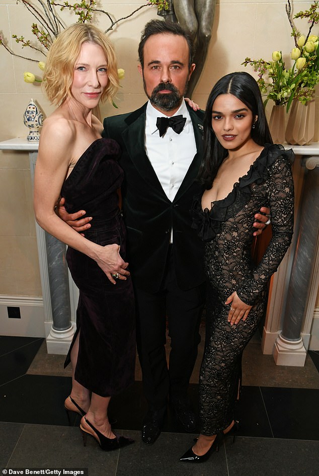 The gorgeous pair posed with the evening's host Evgeny Lebedev