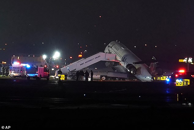 The jet, which was reportedly carrying 76 passengers and crew, being removed from the runway by Port Authority Police following the incident