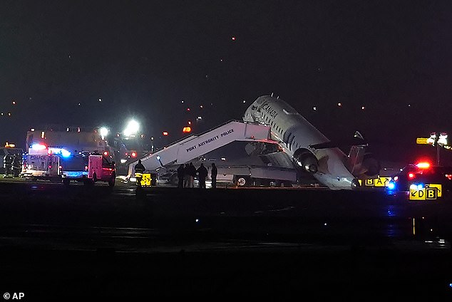 The jet, which had reportedly been carrying 76 passengers and crew, being removed from the runway by Port Authority Police following the incident