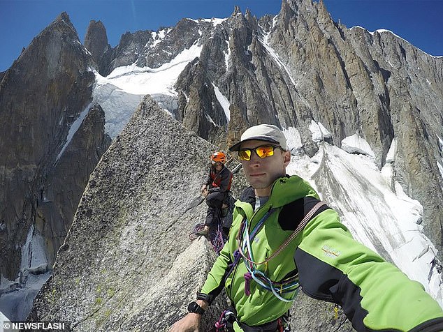 Chiodini, 43, originally from Maniago in the province of Pordenone, died at the scene after rocks came crashing down from above (Pictured: Chiodini poses with another hiker in an undated photo)