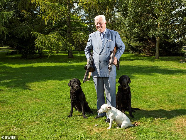 Aristocrat Sir Benjamin Slade on his estate with three of his dogs