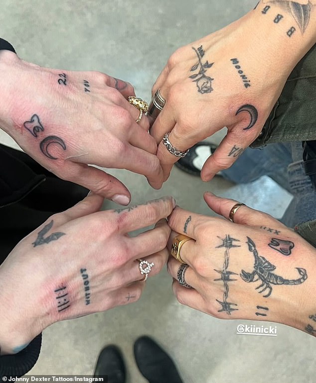 In February, Kelly and Kinicki got matching crescent moon and tooth tattoos on their hands