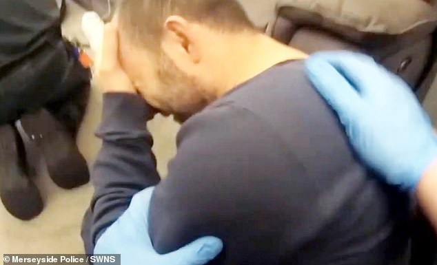 He was later seen with his hands on his head in tears after the paramedics arrived at his house