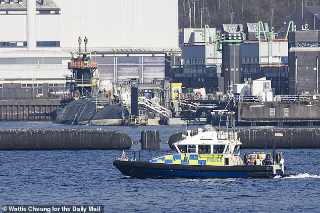 Abutakir, 34, and Valentina, 31 taken into custody after allegedly trying to enter the naval base, which is near Helensburgh, Argyll and Bute, and is home to the UK's nuclear-armed submarines