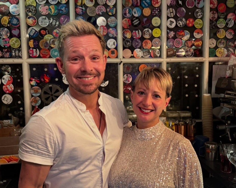 Adam Rickitt and his wife Katy at their bar.
