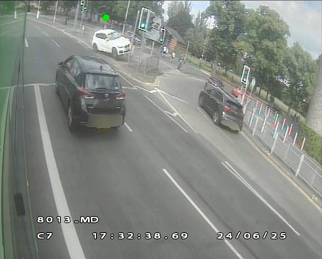 Ahanonu's BMW 1 Series veers out of control on to an island at a junction, demolishing railings