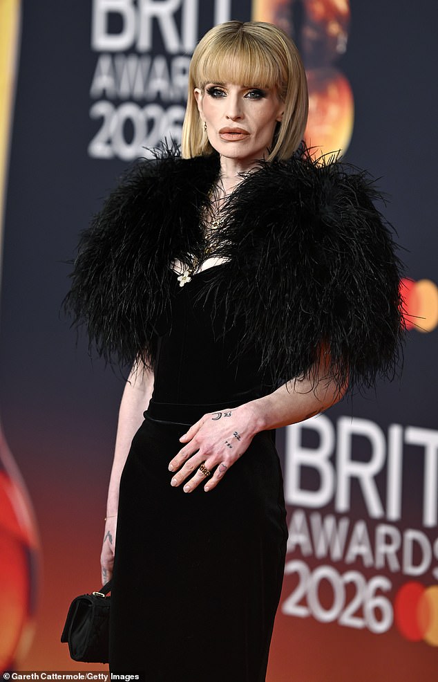 She later wore gold 'Dad' ring in tribute to her late father for the BRITs where the rocker received a Lifetime Achievement Award (pictured)