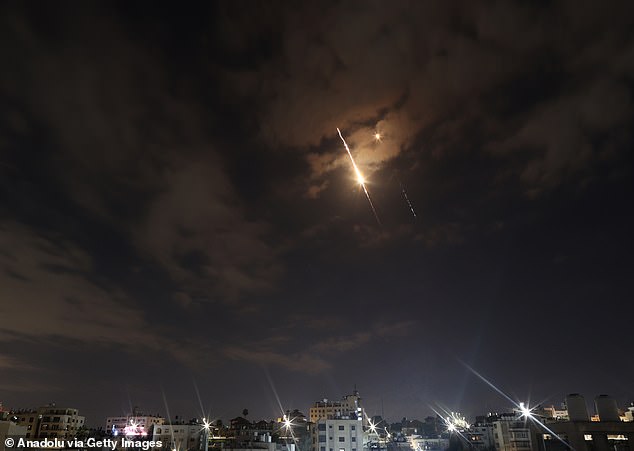 Missiles fired from Iran toward Israel are seen streaking across the night sky over Ramallah, West Bank on March 24, 2026