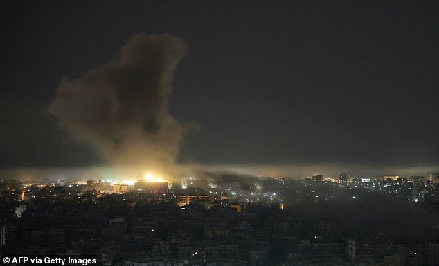 Smoke rises from the site of an Israeli airstrike that targeted an area in Beirut's southern suburbs on March 24, 2026