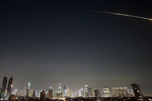 Missiles launched by Iran streaked through Tel Aviv early on Tuesday morning after a fresh wave of Iranian strikes