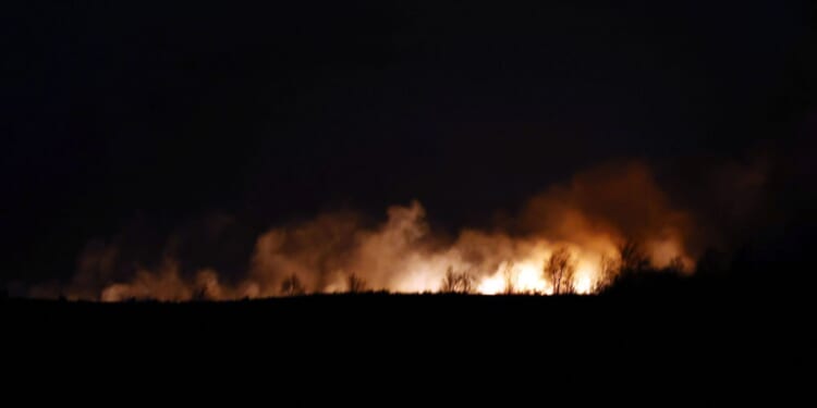 Moment roaring fire rips through moors with flames seen for miles & locals told ‘stay away’