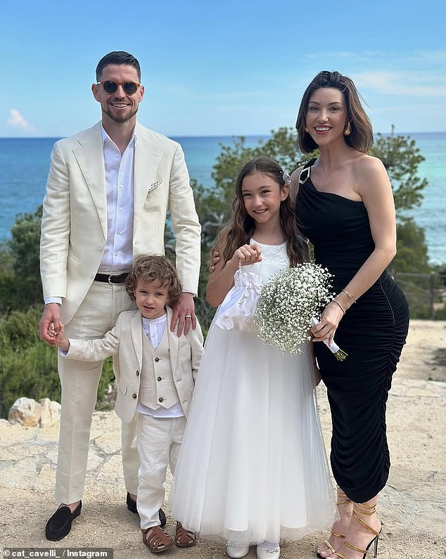 Jorginho hit out at the singer after he claimed her security staff left his stepdaughter Ada in tears (pictured with wife Catherine Harding, their son, Jax, four, and Ada - who Catherine shares with Jude Law)