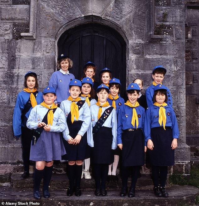It means all trans girls ¿ those born male but identifying as female ¿ must stop attending Girl Guides, Brownies and Rainbows groups from that date. Pictured: Girl guide troop in the 1980s