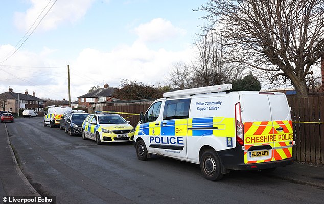 Police vehicles pictured in  after the attack on 84-year-old John McColl