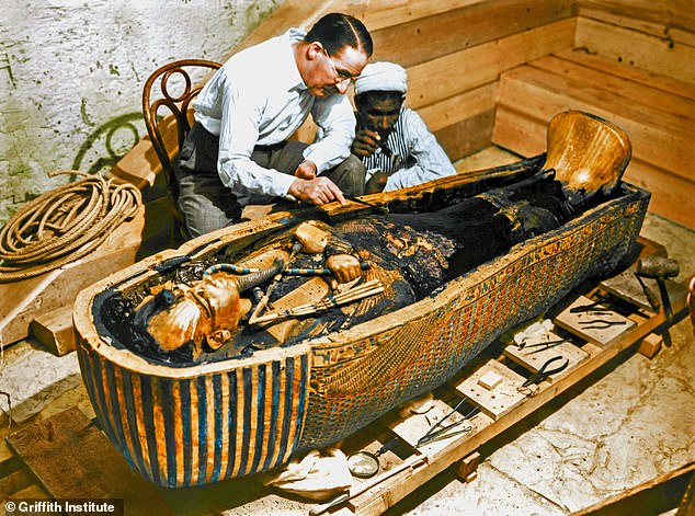 Archaeologist Howard Carter examines Tutankhamun's tomb after its discovery in 1922/23