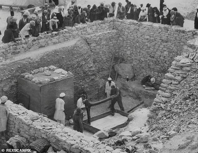 Tourists watch the removal of artefacts from Tutankhamun's tomb in Luxor in February 1923