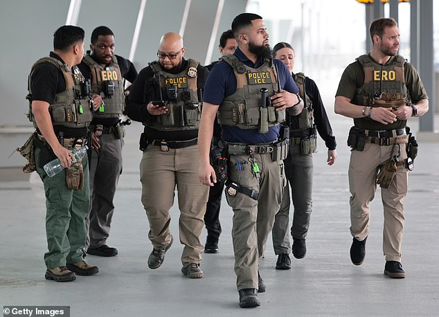 Immigration and Customs Enforcement (ICE) agents patrol Terminal B at LaGuardia Airport in New York City on Monday