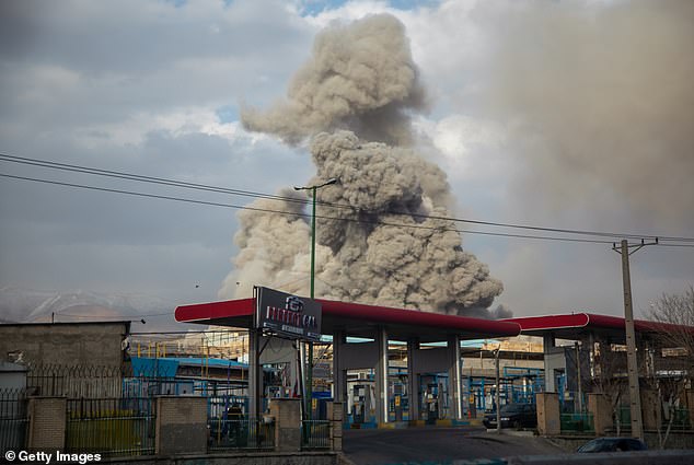 A plume of smoke rises after an explosion in Tehran, Iran