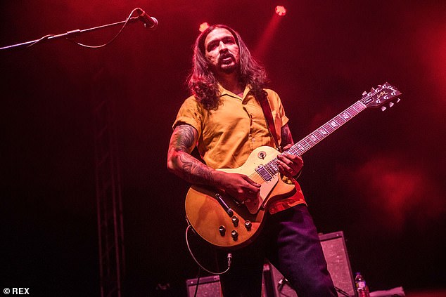 The guitarist (pictured, performing with The Zutons in 2019), who is in his forties, said he was out with his five-year-old son when a gang of teens began smoking near them
