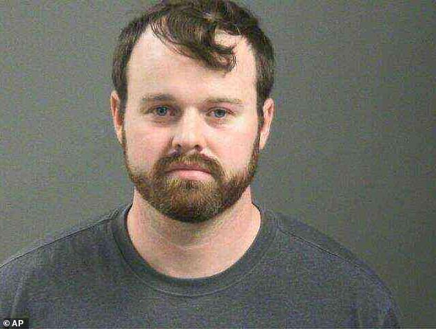 Her arrest came two days after her husband Joseph was arrested in connection with allegations that he touched a nine-year-old girl on her underwear and genitals; his March 18 mugshot seen above