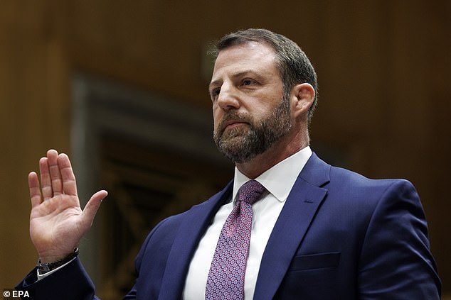 US Senator Markwayne Mullin is sworn in during a hearing for the position of US Secretary of Homeland Security at the US Capitol, March 18
