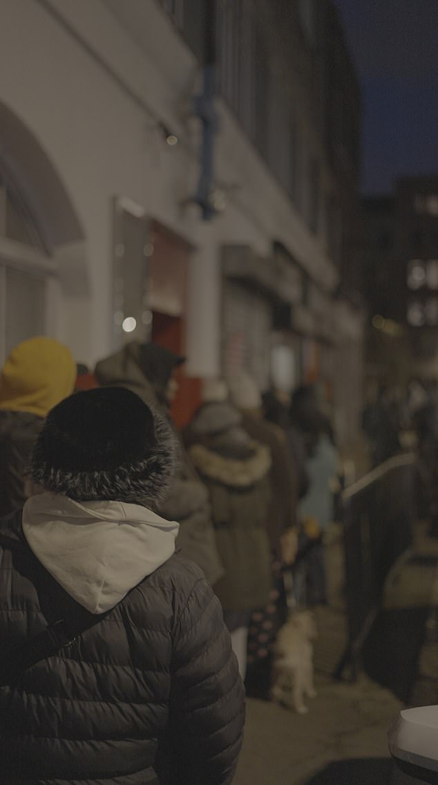Cold evenings bring delivery riders in to soup kitchens along with other rough sleepers. Some are even wearing their backpacks bulging with sushi, burgers and curries bound for other stomachs. Pictured: A queue for a soup kitchen