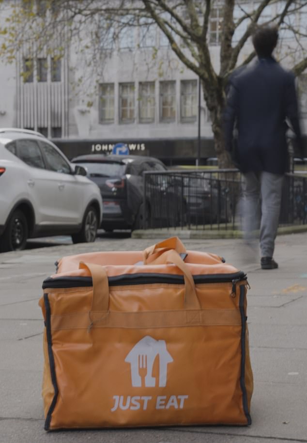 The next time I get my 'hangover' Katsu curry, I'll be offering the rider more than just the delivery code. Pictured: A rider's food delivery bag