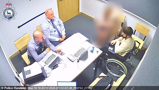Clifford, pictured in a wheelchair, is interviewed by Hertfordshire Constabulary detectives