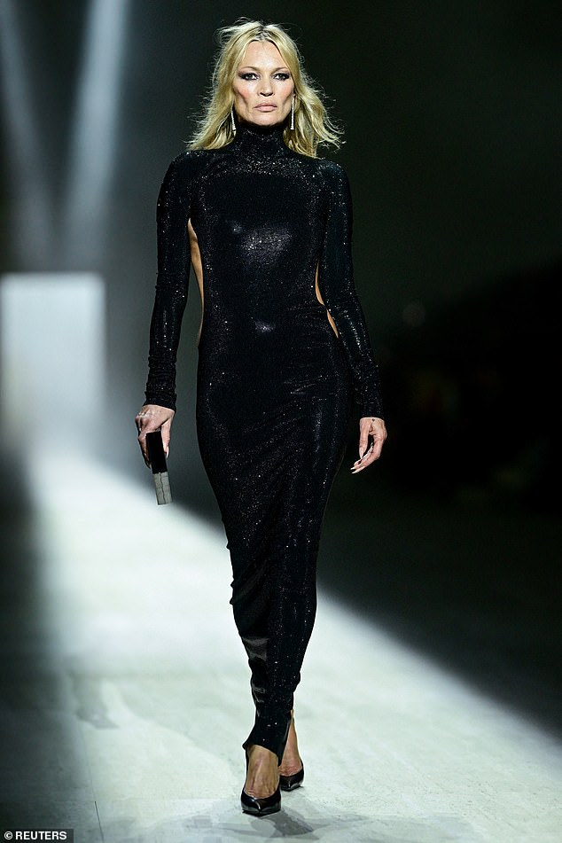 She spoke about her mother's incredible personal fashion archive as one of the world's most stylish women, saying: 'My mum finds me in her wardrobe at least once a week, but I know anything truly off-limits will be hidden. So, yes, that vintage Dior Bar jacket is mine' (Kate pictured on the Gucci catwalk)