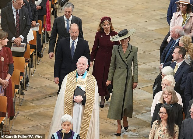 Dr David Monteith (front) leads the Prince and Princess of Wales as they arrive for the Enthronement Ceremony
