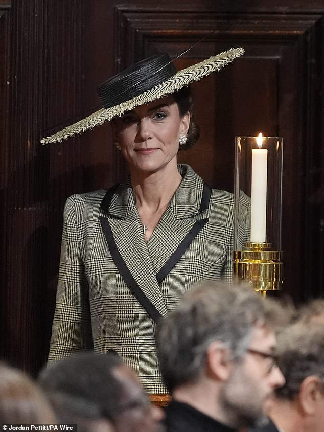 Kate wore a long grey fitted Suzannah coat and a wide-brimmed Juliette Botterill hat