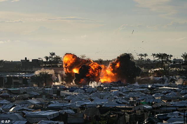 Smoke and flames rise following an Israeli military strike on a target in Deir al-Balah, central Gaza Strip, Wednesday, March, 25, 2026