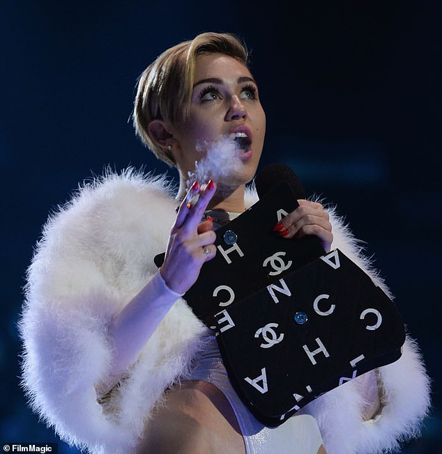 Miley has long been a proponent of smoking and legalizing marijuana, famously lighting a joint up on stage during her 2013 MTV EMAs performance in Amsterdam (pictured)