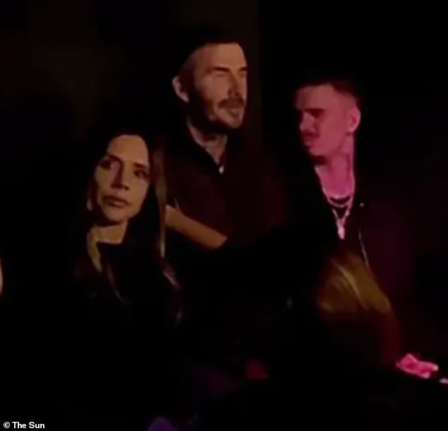 Victoria, David and Romeo looked emotional as they watched from their seats at the venue