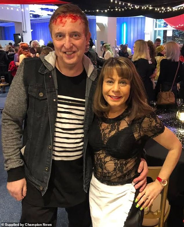 Darren Hill and his late wife Marnie Hill (pictured at a party), who took her own life aged 49 in May 2022