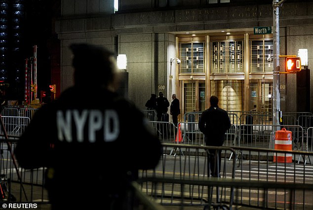 NYPD officers stood guard outside of the Daniel Patrick Moynihan United States Court House early Thursday morning before media, protestors, and members of the public gathered