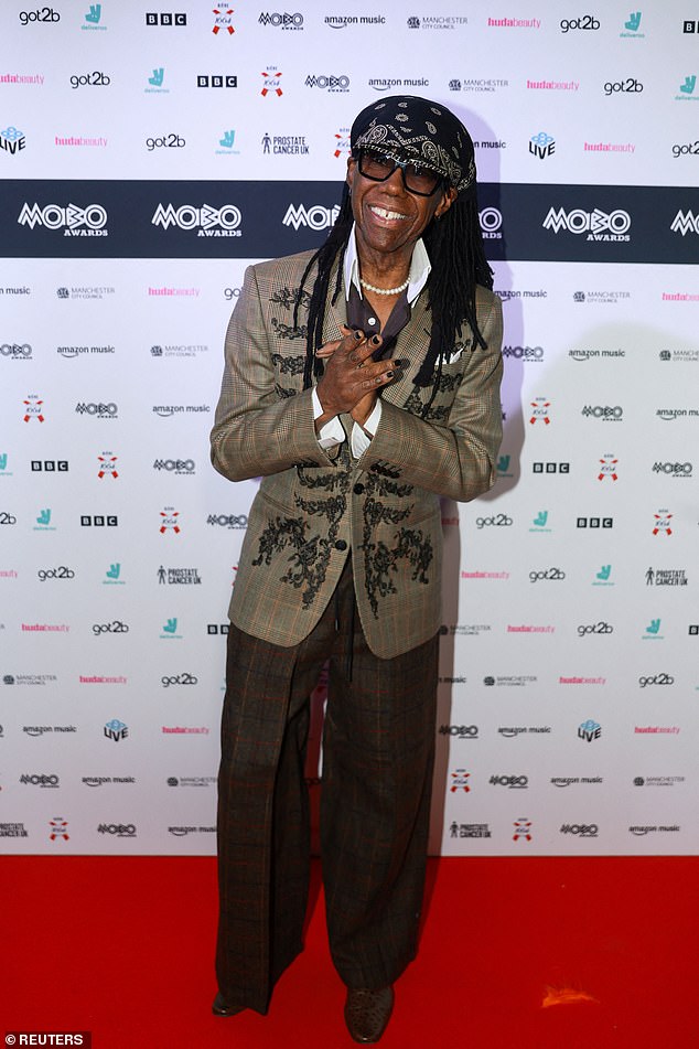 Nile Rodgers, 73, appeared in great spirits as he arrived at the venue, posing up a storm on the red carpet ahead of the ceremony