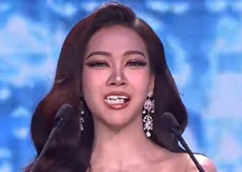 Bizarre moment beauty pageant contestant's TEETH fall out during speech before she bravely makes comeback to finish talk