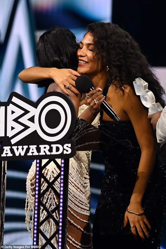 Indiyah proudly presented Olivia her third award of the night as they sweetly embraced before leaving the stage